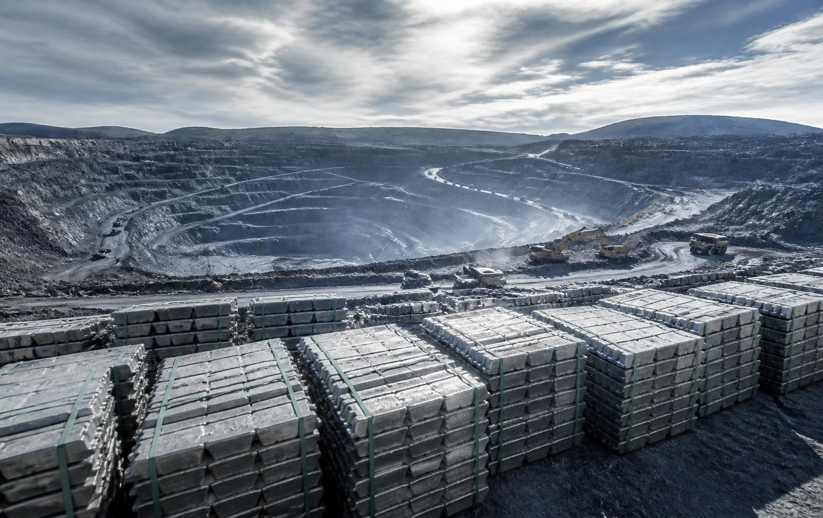 Bulk metal ingots stacked at an industrial mining and processing site